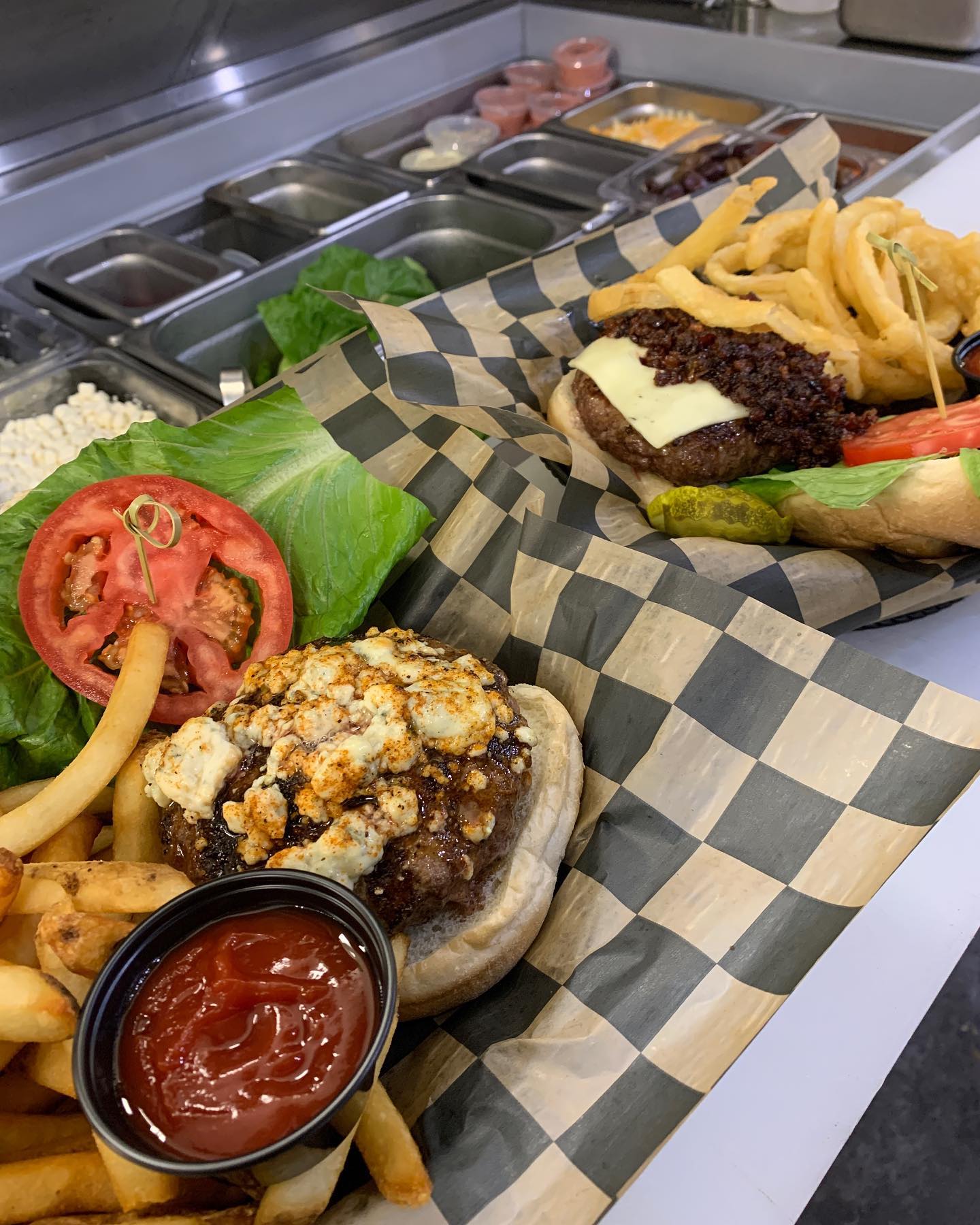 | Shoppers Pub and Eatery Happy National Burger Day Come Check  out the cajun blue cheese crumble Bruiser left and the home made bacon bourbon jam Jammed right